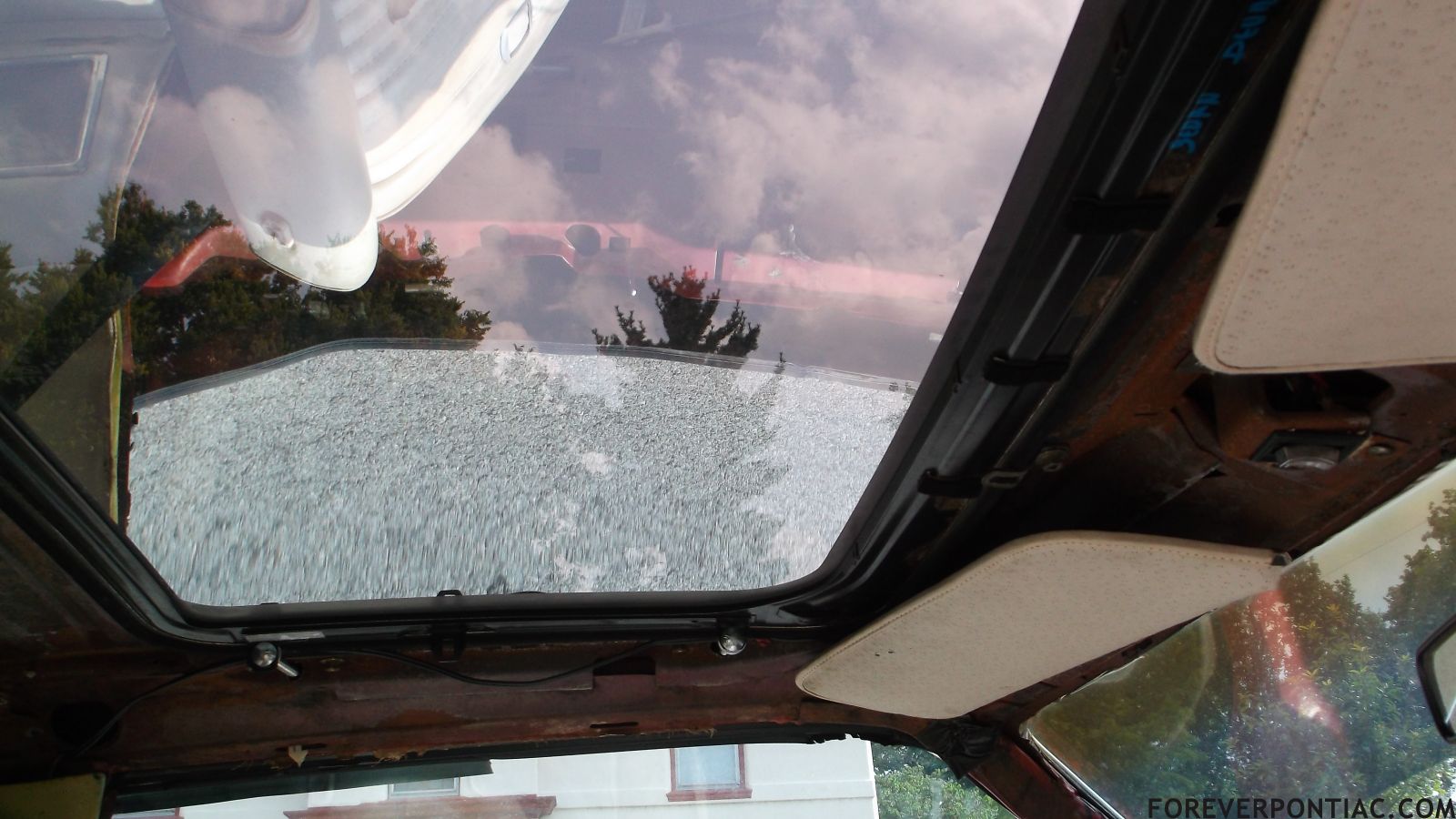 the ol' Caddy sunroof that was rigged and taped in place when I got her...